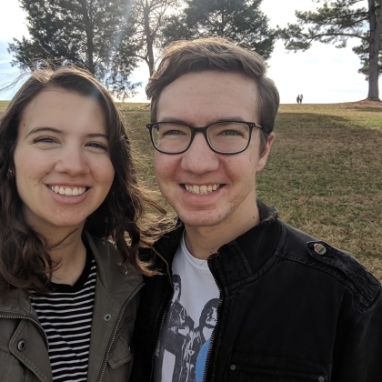 Summer and her partner say cheese in nature. 